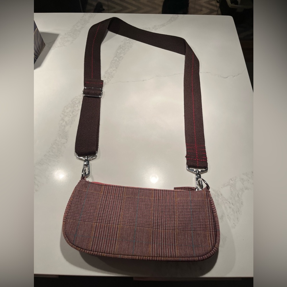 Red plaid baguette bag with guitar strap. Urban outfitter bag!